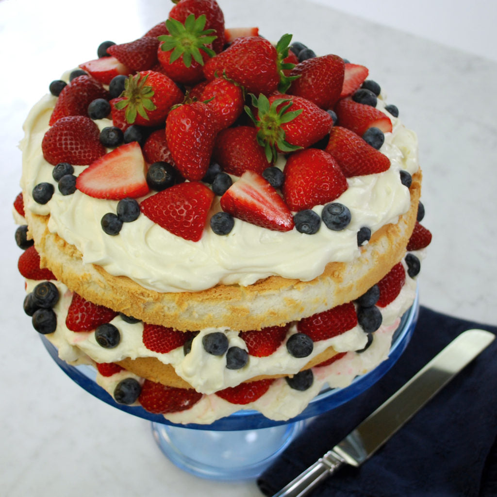 Image of the Angel Food Cake with Frosting and Berries Recipe