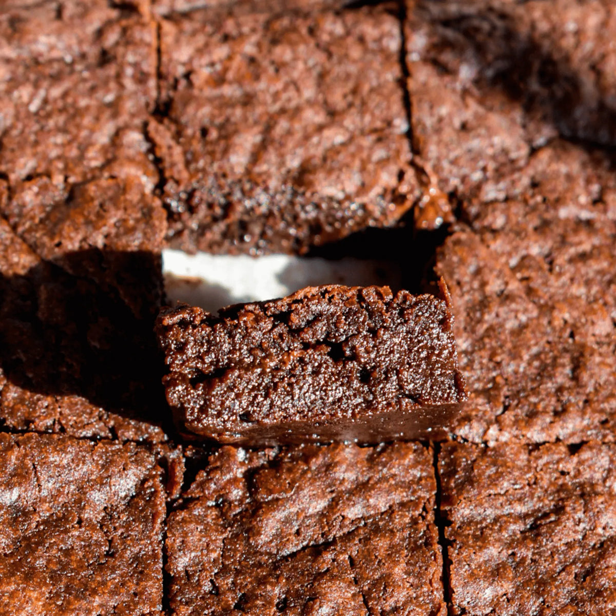 Close-up of sliced brownies with a rich, dark color.