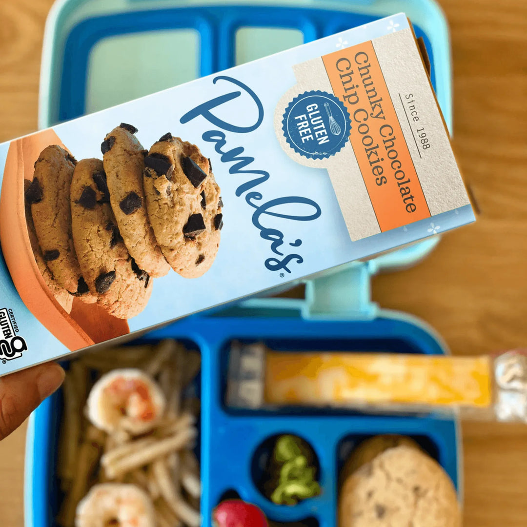 Box of Pamela's Chunky Chocolate Chip Cookies in front of a lunchbox with snacks.