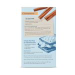 Pampered Chef s'mores kit packaging with cinnamon sticks and graham cracker illustration on a light blue background.