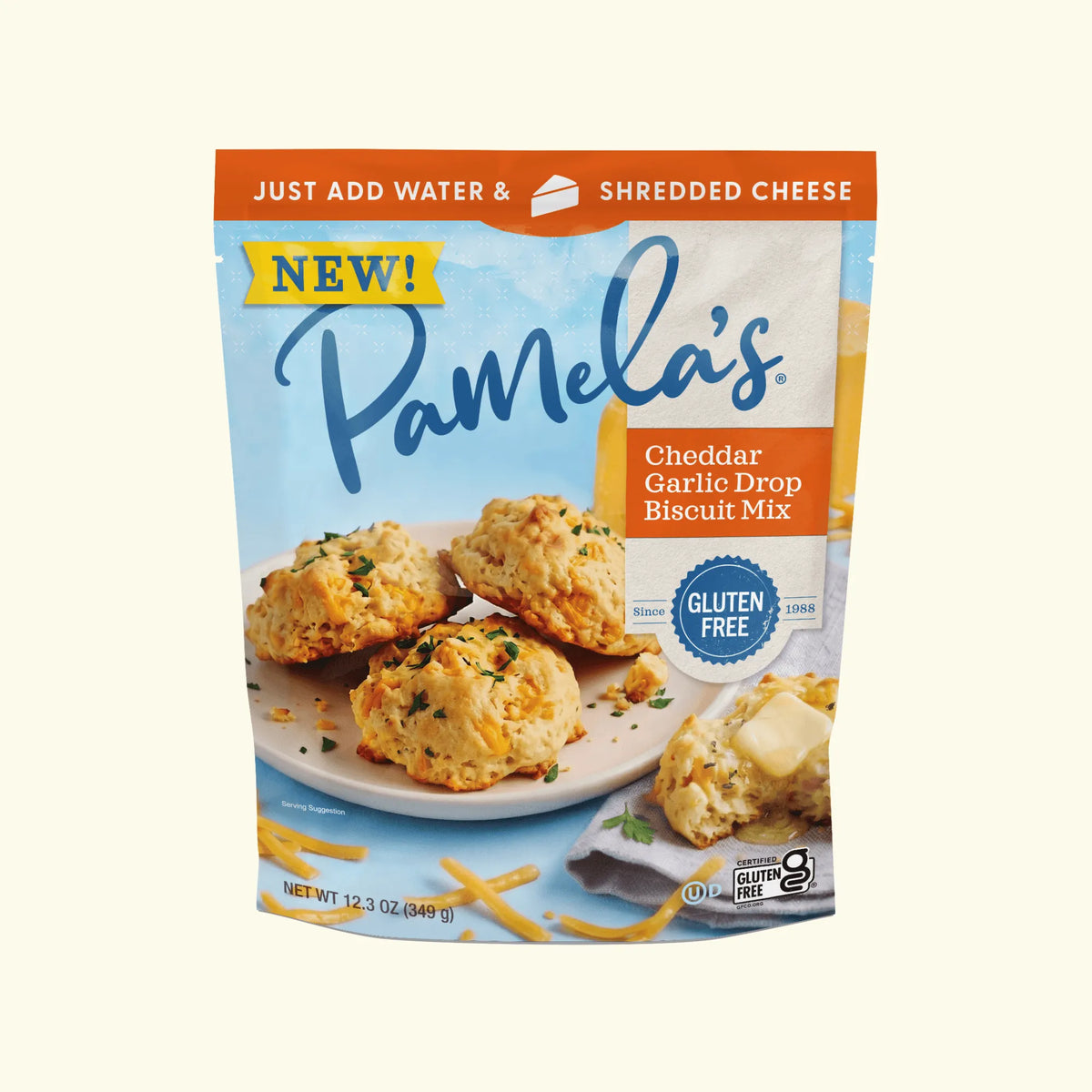 Pamela's Gluten-Free Cheddar Garlic Drop Biscuit Mix, 12.3 oz package with warm gluten-free cheddar garlic drop biscuits brushed with garlic butter